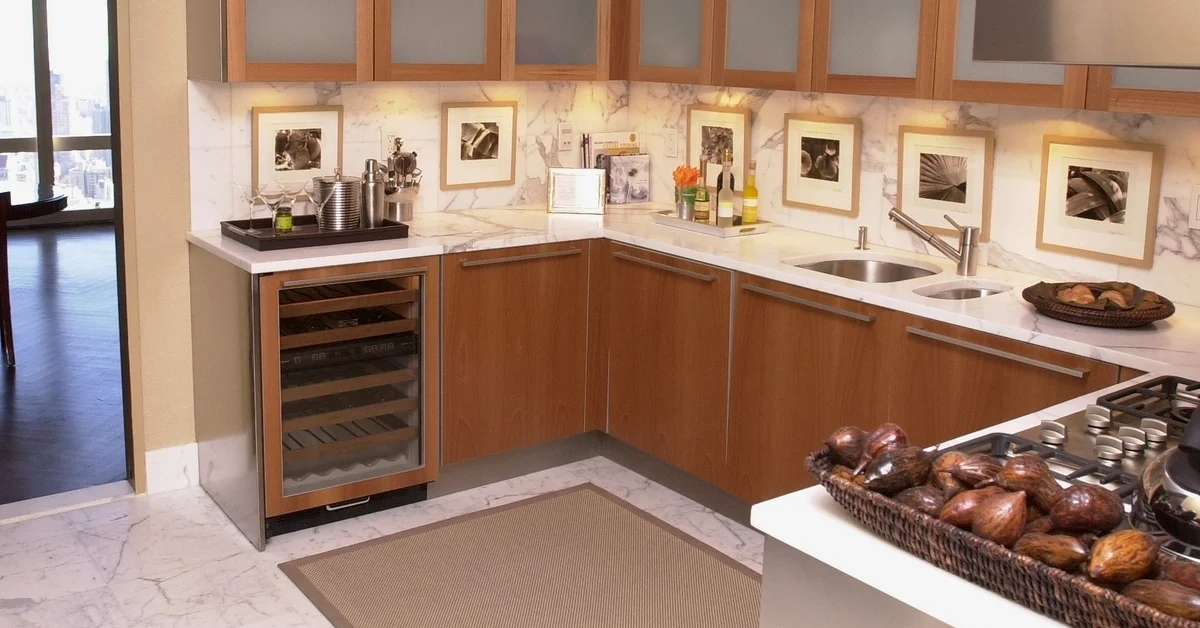 Neat kitchen with rug on the floor.