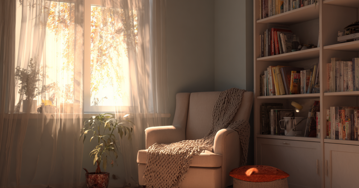 A cozy reading corner by a book shelves in a home.